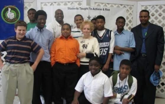 STAR graduation group photo at Shiloh Middle School, with Board Chairman Louise Radloff (center) and Pastor Jesse Curney (right), 2008